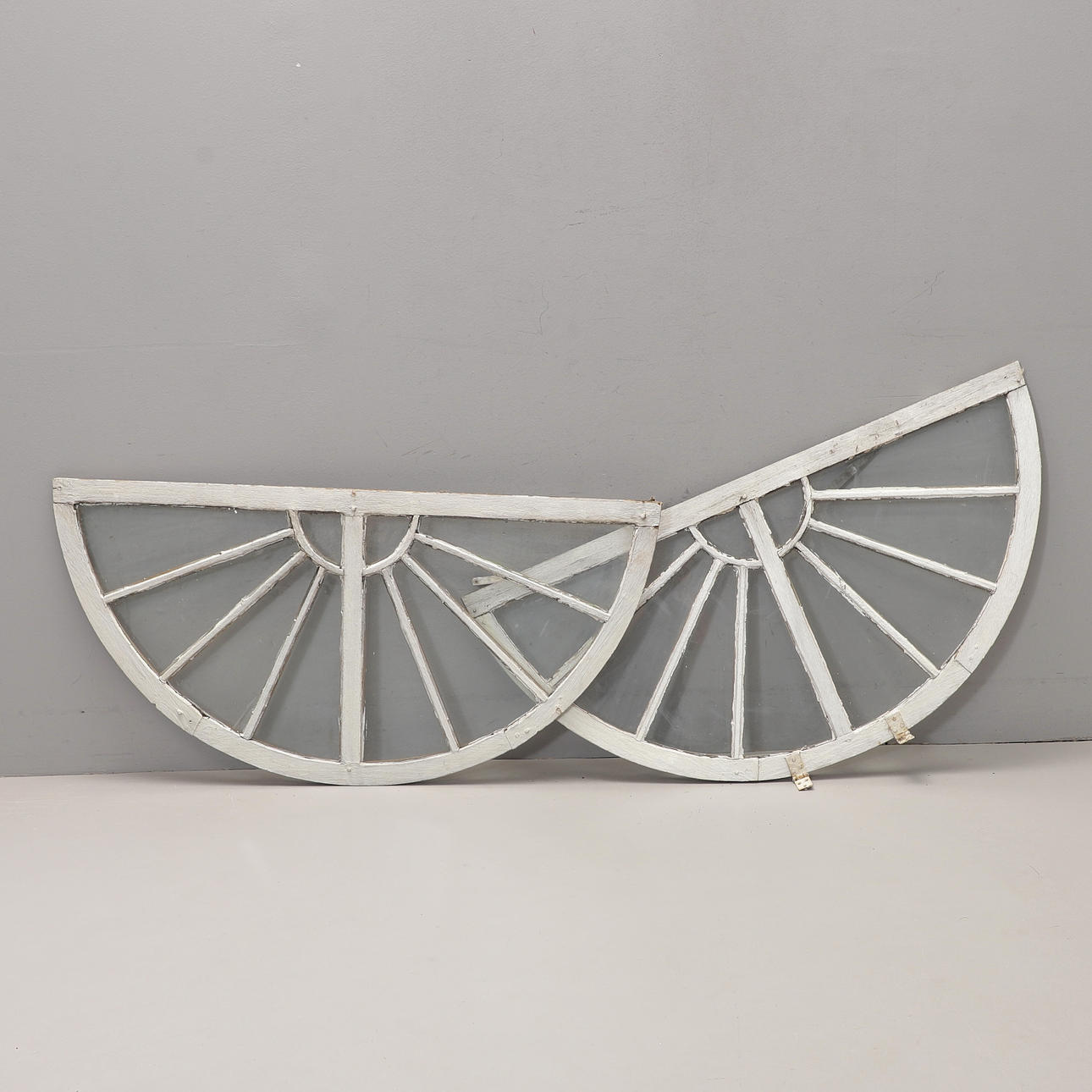 HALF-MOON WINDOWS, a pair, 19th century.