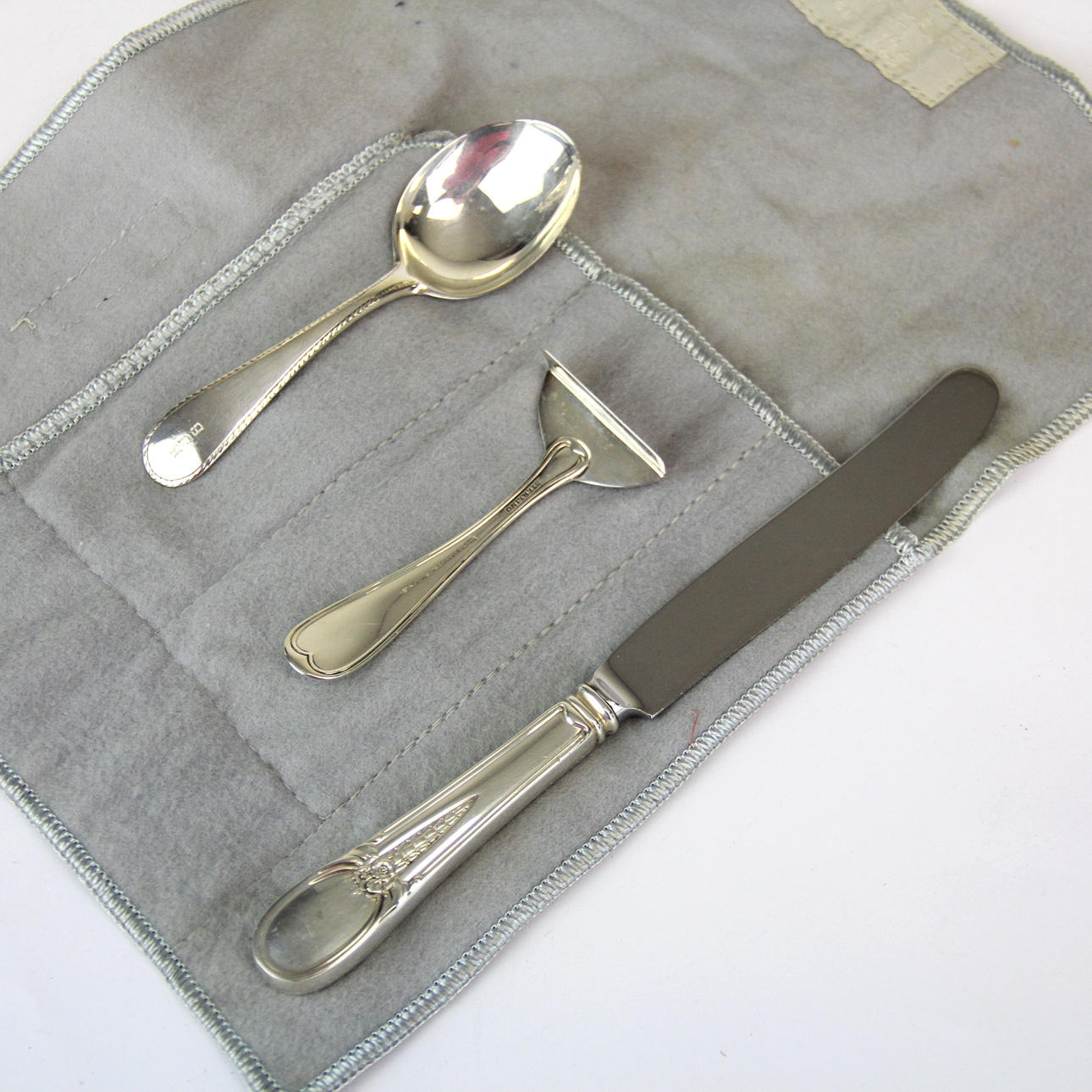 THREE GEORG JENSEN SILVER CHRISTENING ITEMS.