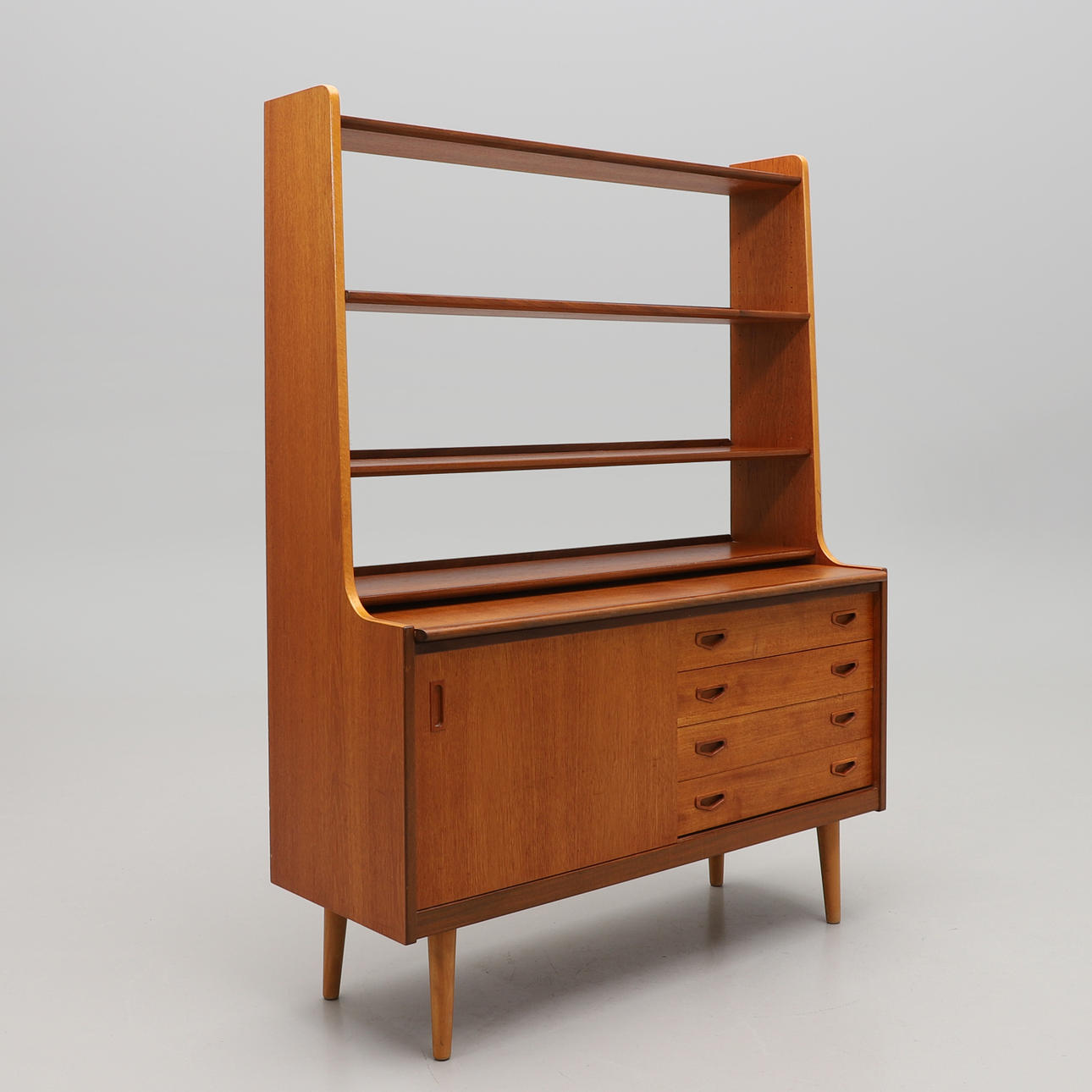 BOOKSHELF, veneered in teak, with writing board, 1950s.