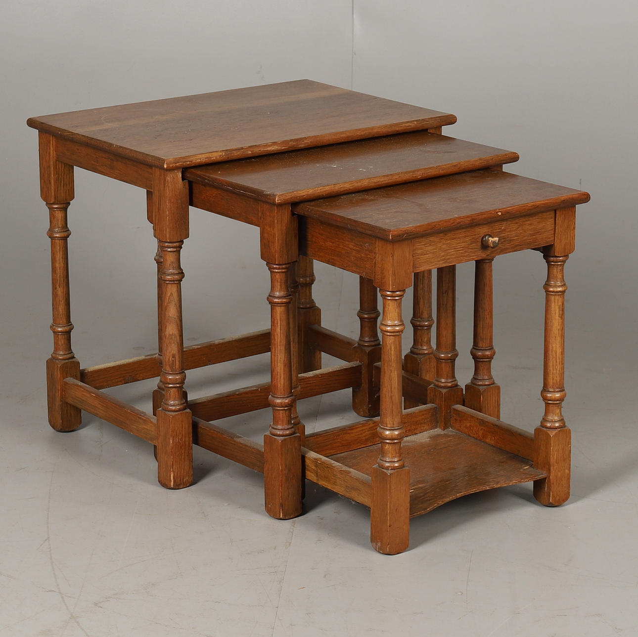 A VINTAGE NEST OF TABLES.