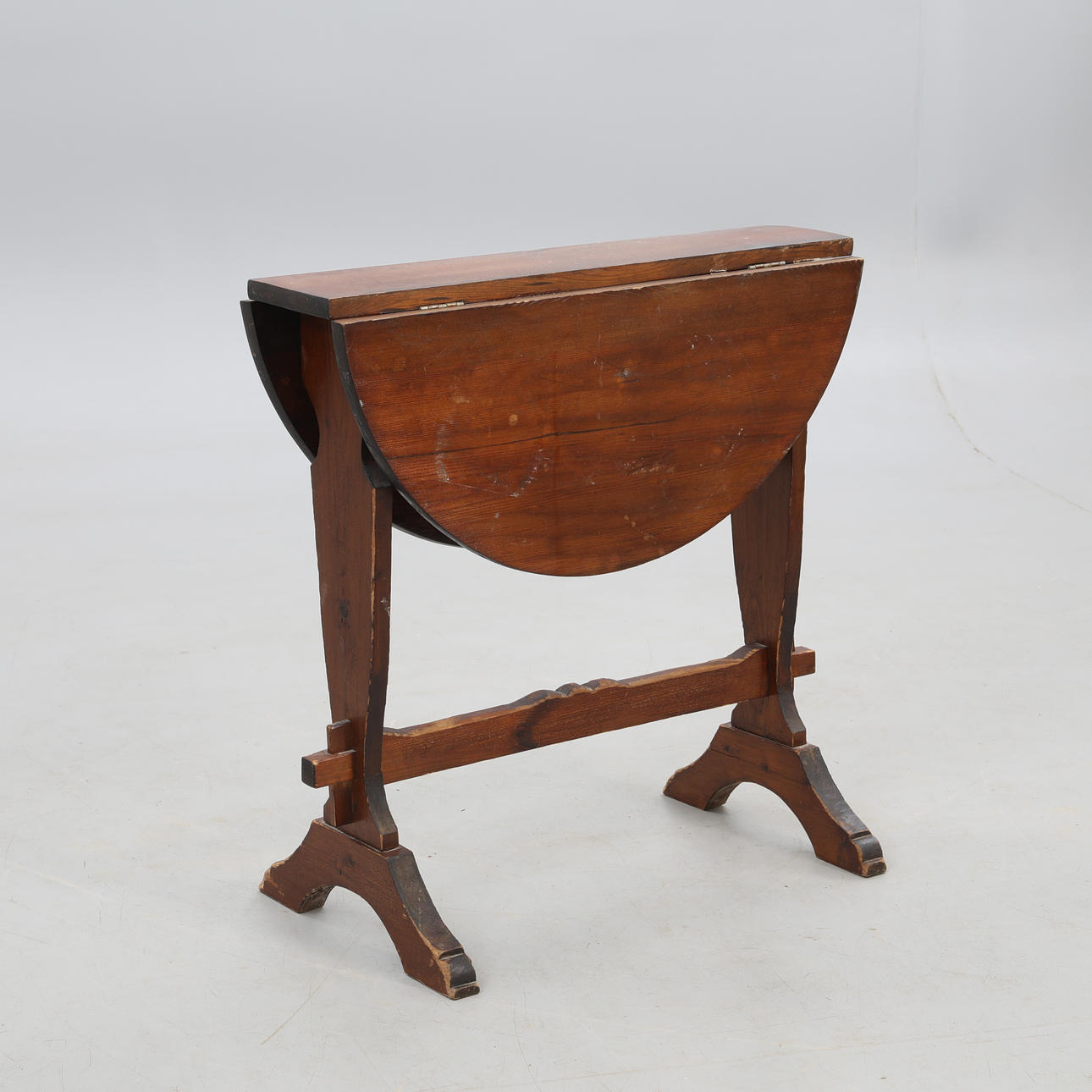 FLAP TABLE, round flaps, stained pine, mid-20th century.