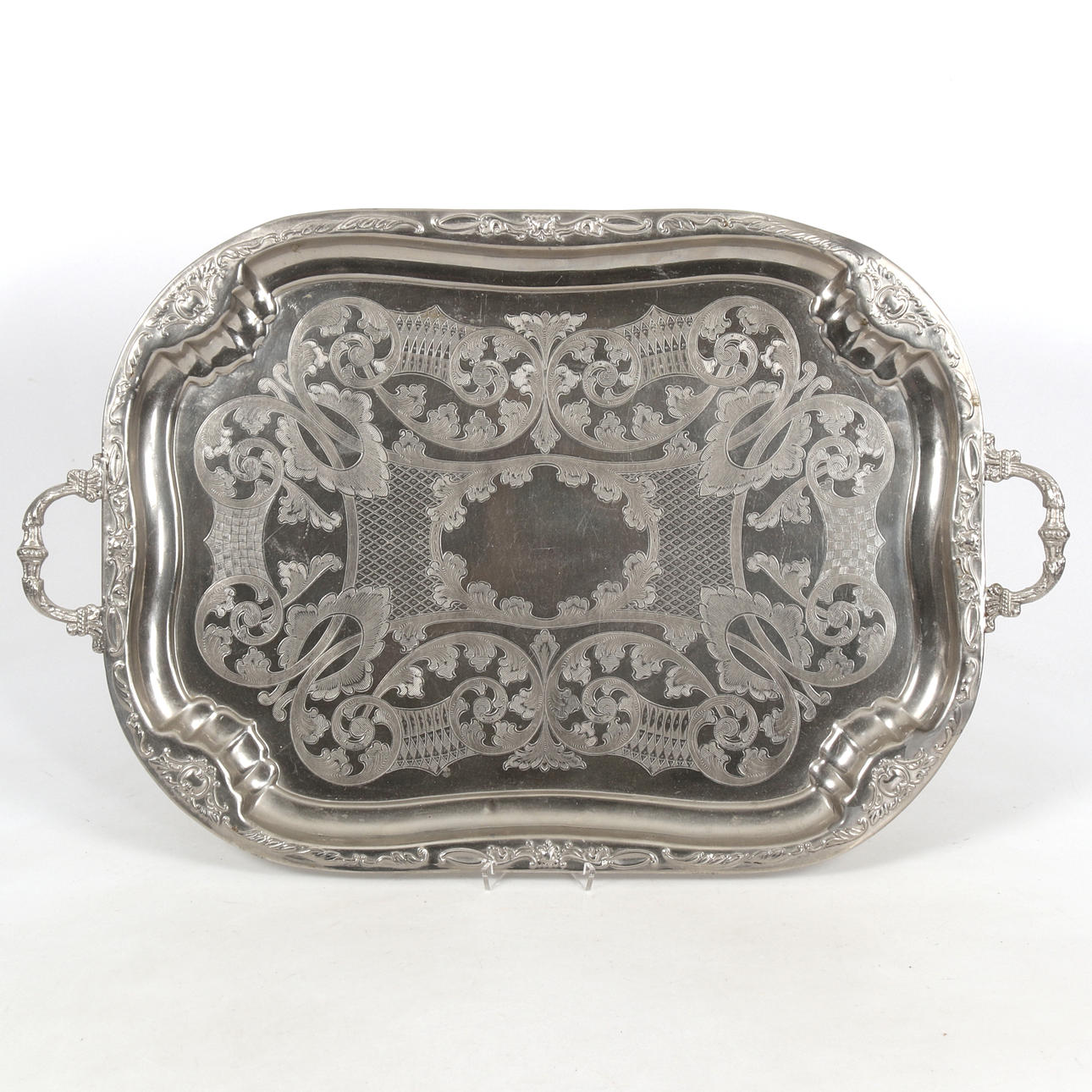 BRICKA, graverad metall, 1900-tal.