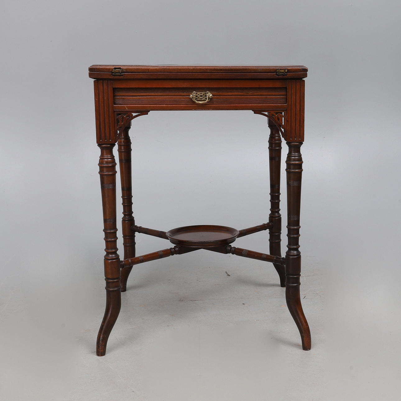EDWARDS & ROBERTS: AN EDWARDIAN WALNUT ENVELOPE TOP CARD TABLE.