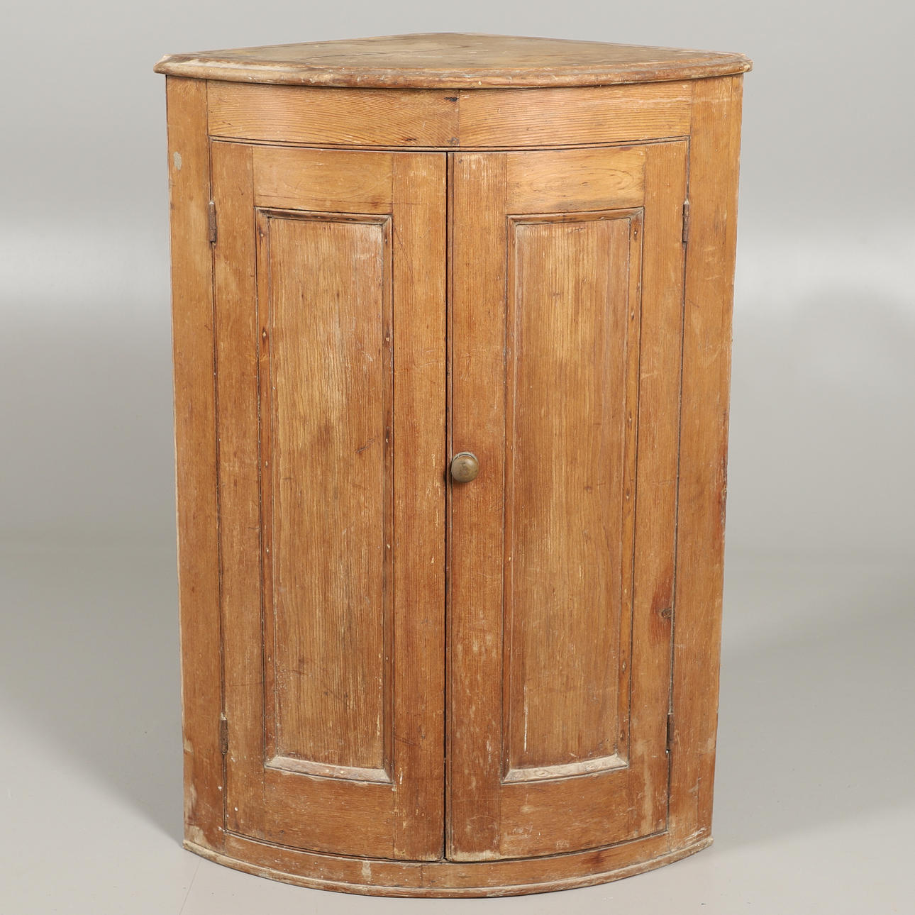 A PINE CORNER CUPBOARD.