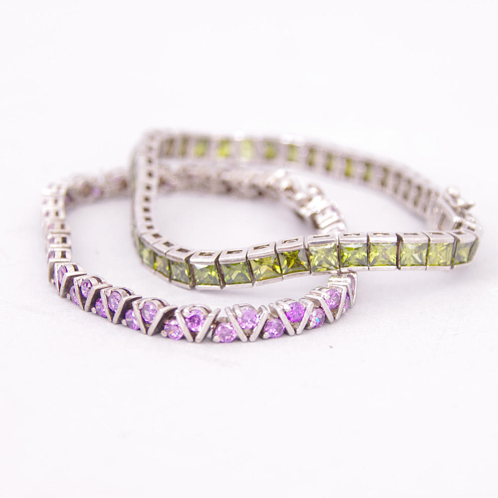 ARMBAND, 2 stycken, silver med färgade stenar.