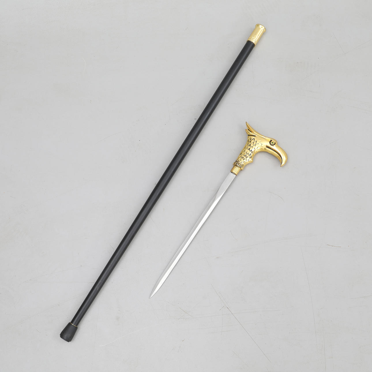STICK with hidden SWORD, yellow metal, eagle head.