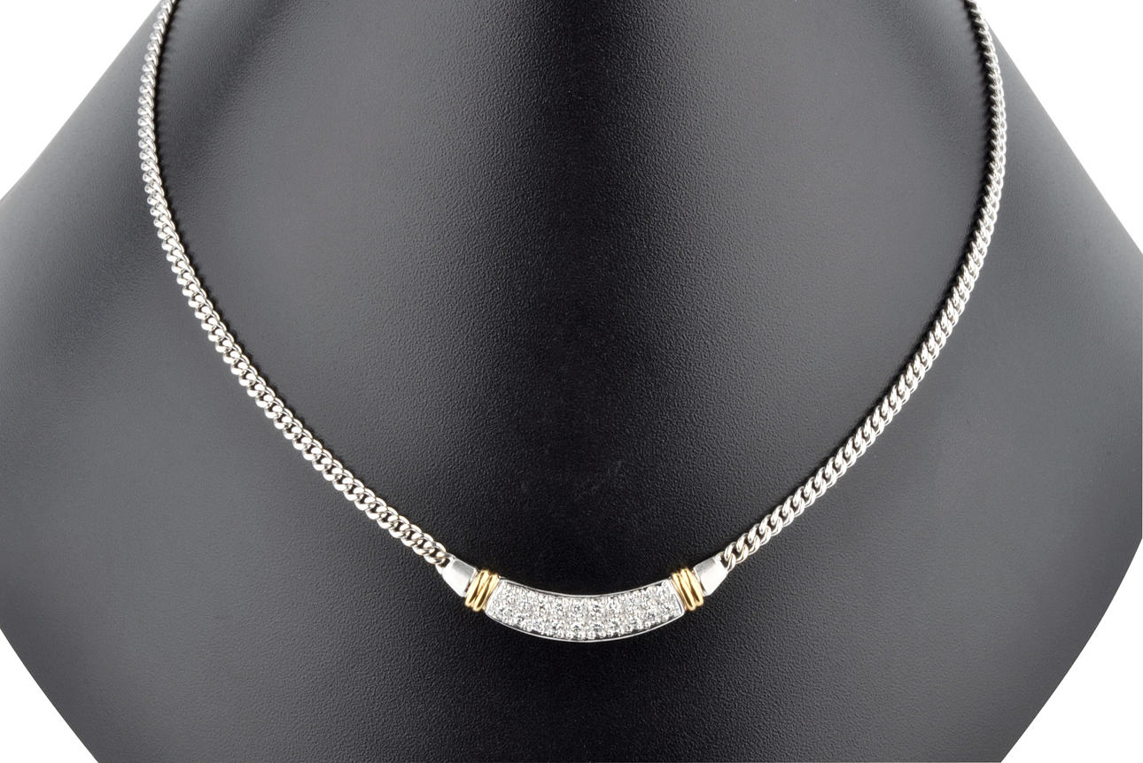 COLLIER med 20 briljantslipade diamanter ca. 0.50 ct 585 vitt och gult guld ca. 13,3 g.