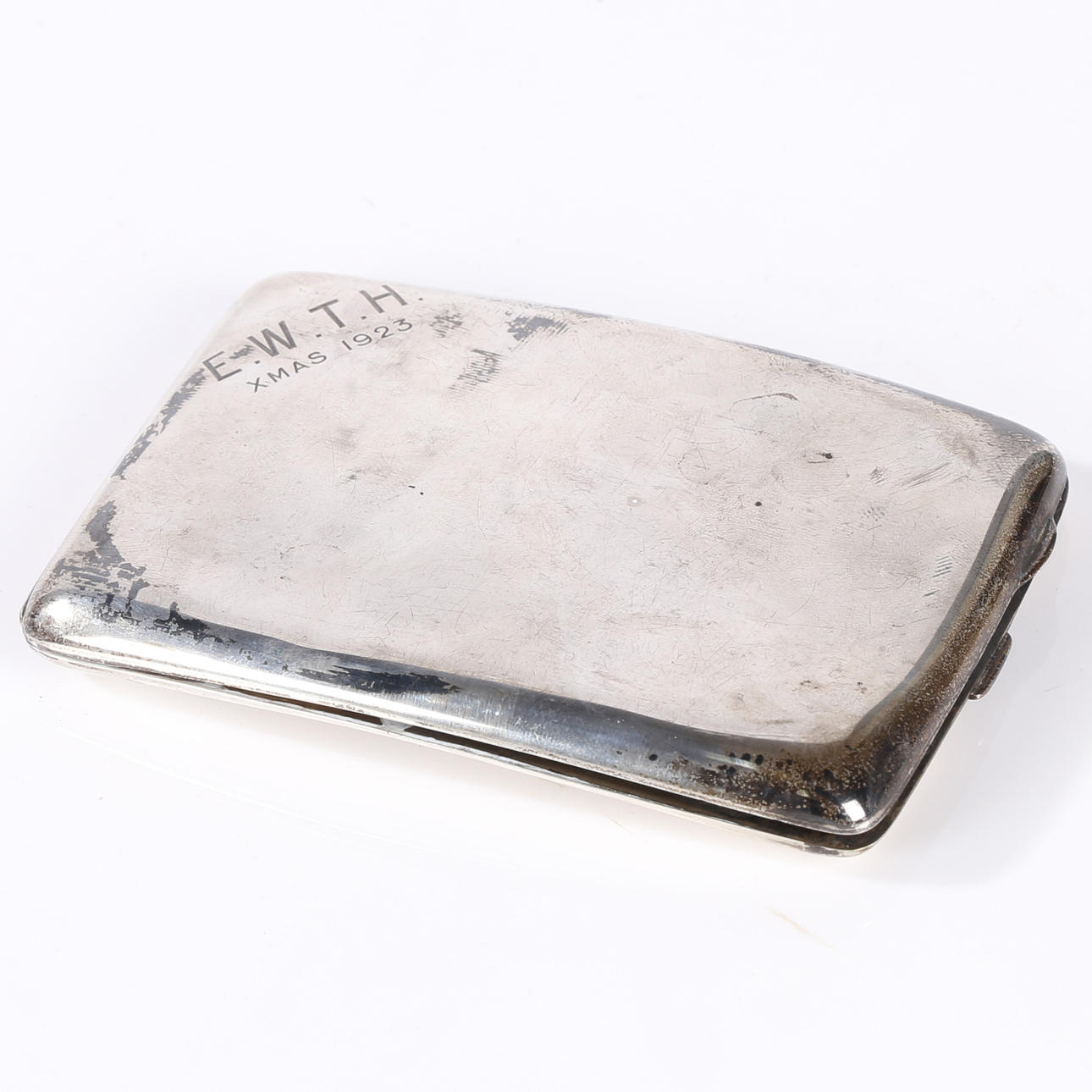 A GEORGE V SILVER CIGARETTE CASE.