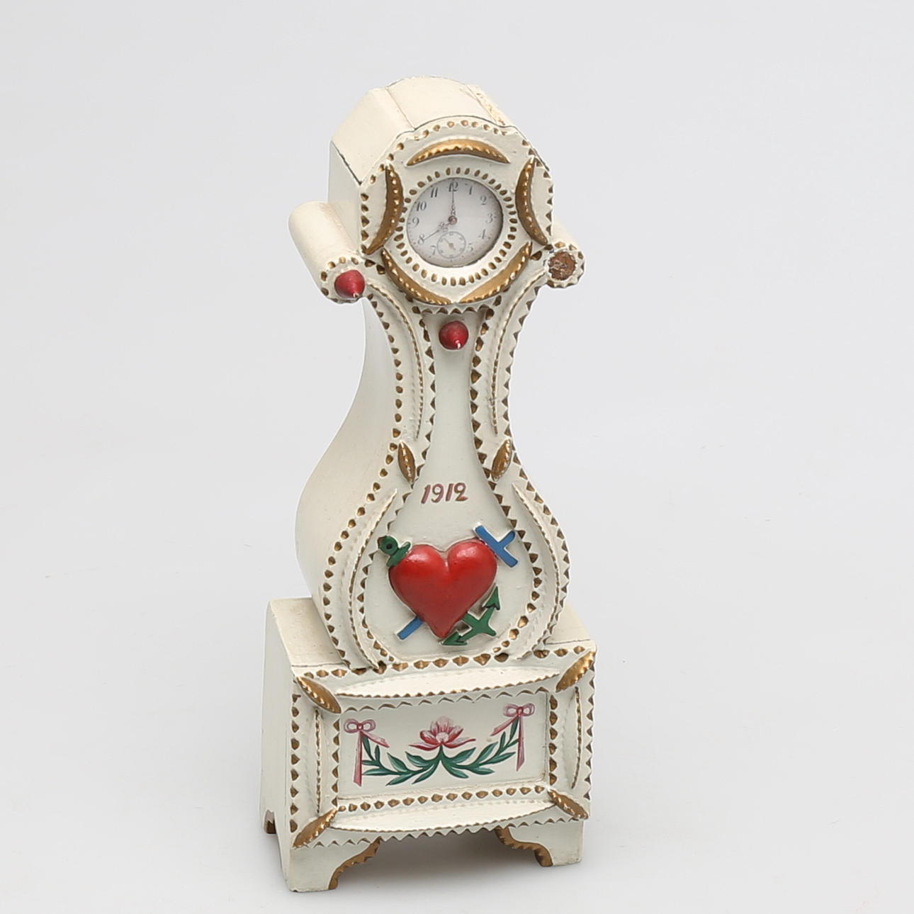 MINIATYRGOLVUR i trä daterat 1912.