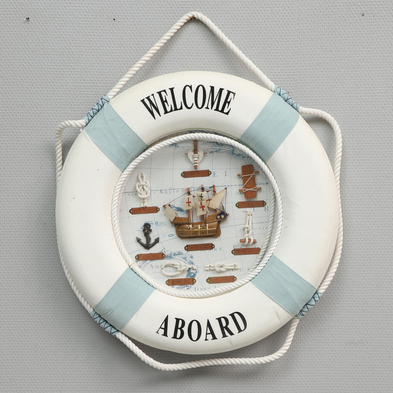 NAUTICAL CHART, knots and ship model in lifebuoy.