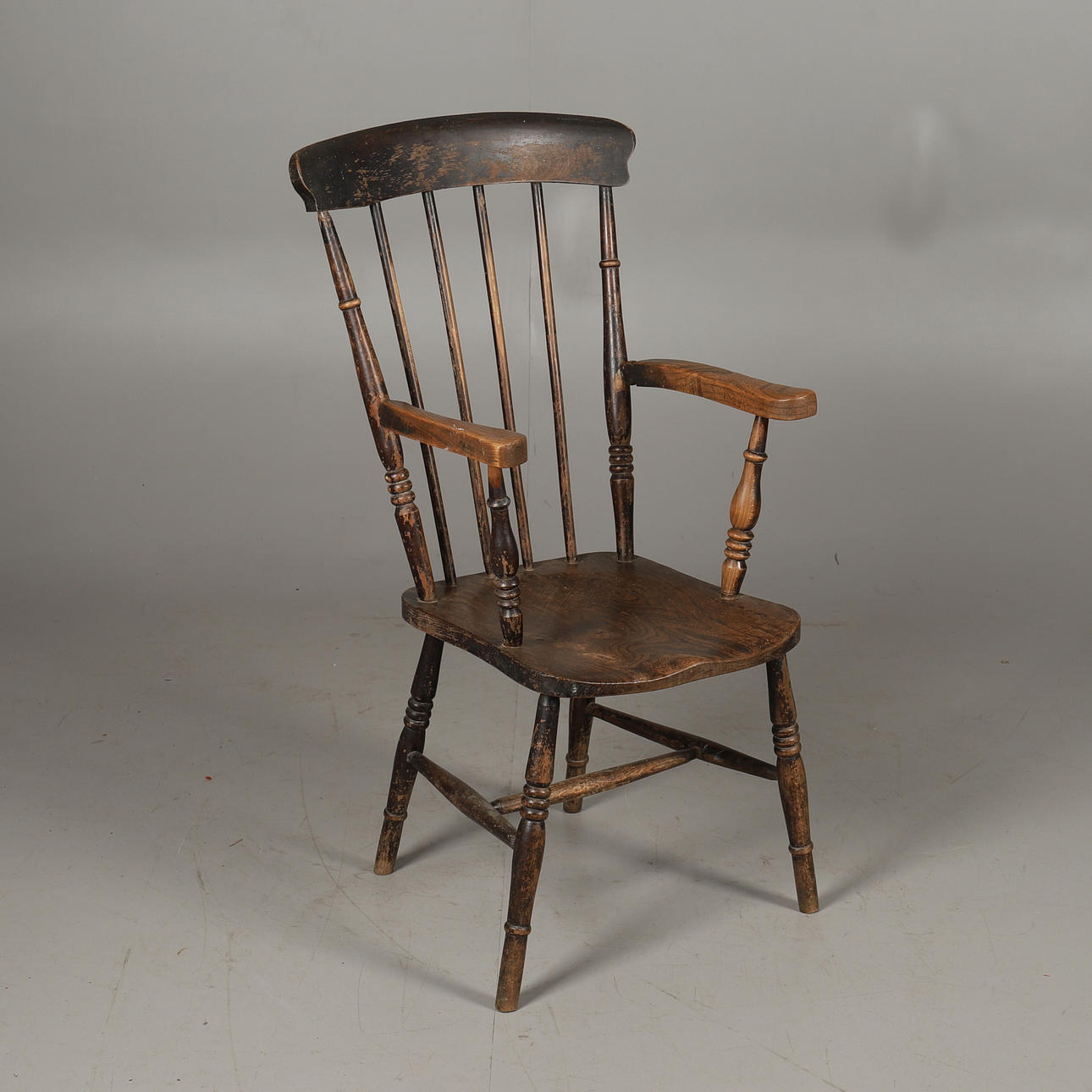 A 19TH CENTURY STICK BACK KITCHEN ARMCHAIR.