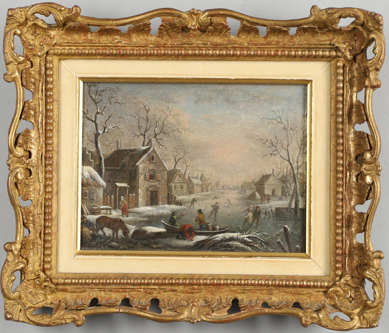 IN THE MANNER OF DENYS VAN ALSLOOT (C.1570-C.1628). A BUSY WINTER SCENE WITH VILLAGERS ON A FROZEN RIVER.