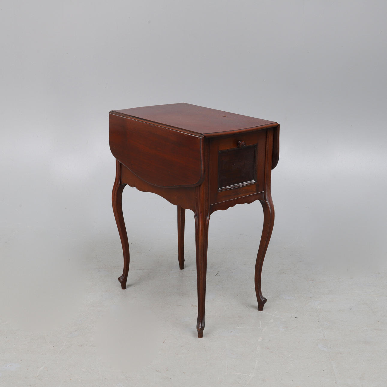 A MAHOGANY BEDSIDE TABLE, CIRCA 1890.
