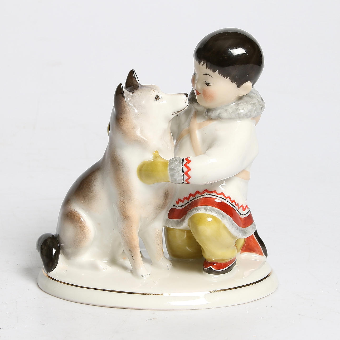 FIGURIN, porslin, Inuit med hund, Lomonosov, Ryssland. 1900-talets andra hälft.