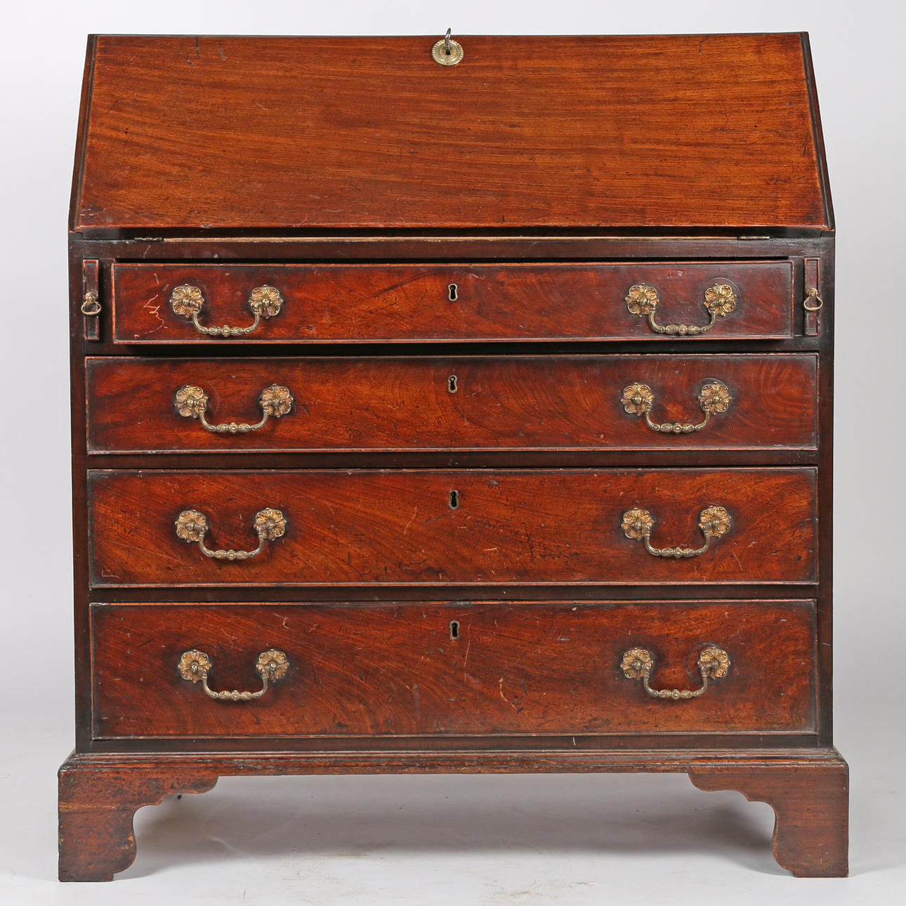 A GEORGE III MAHOGANY BUREAU.