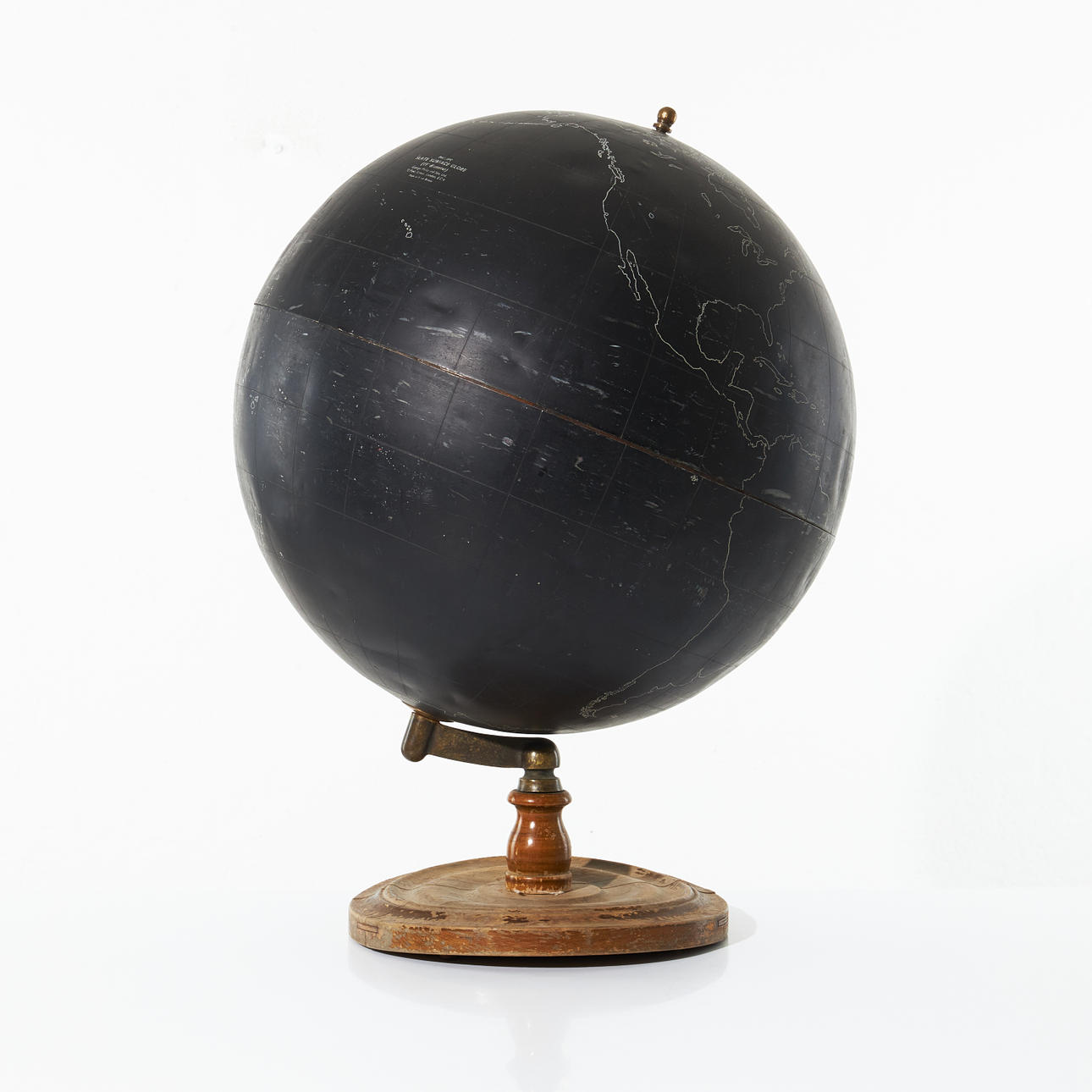 PHILIP'S SLATE SURFACE GLOBE, circa 1950, the globe in blackened metal with white outlines, foot in turned wood.