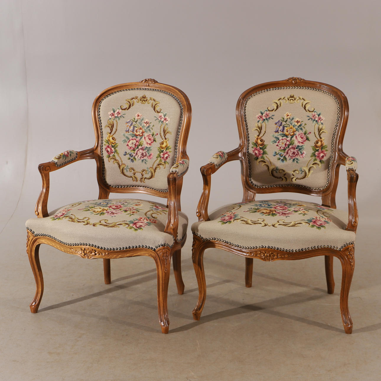 ARM CHAIRS, 1 pair, walnut with embroidered upholstery, rococo style ...
