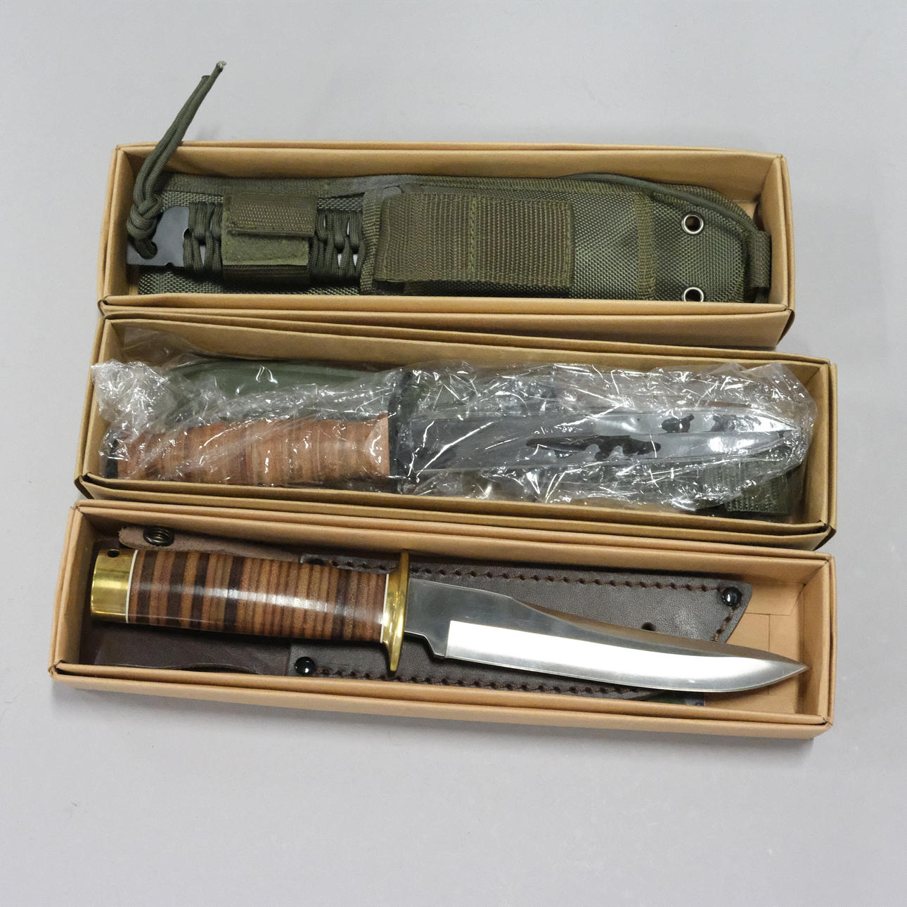 THREE REPLICA KNIVES.