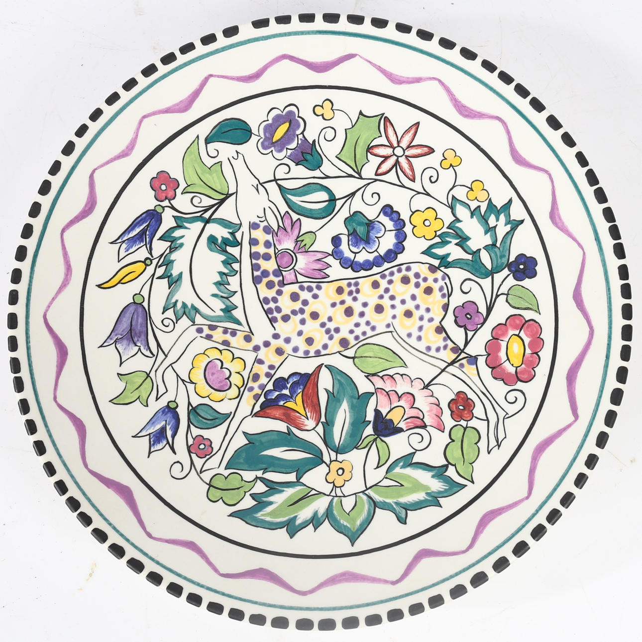 A POOLE POTTERY "PERSIAN DEER" PLATE.