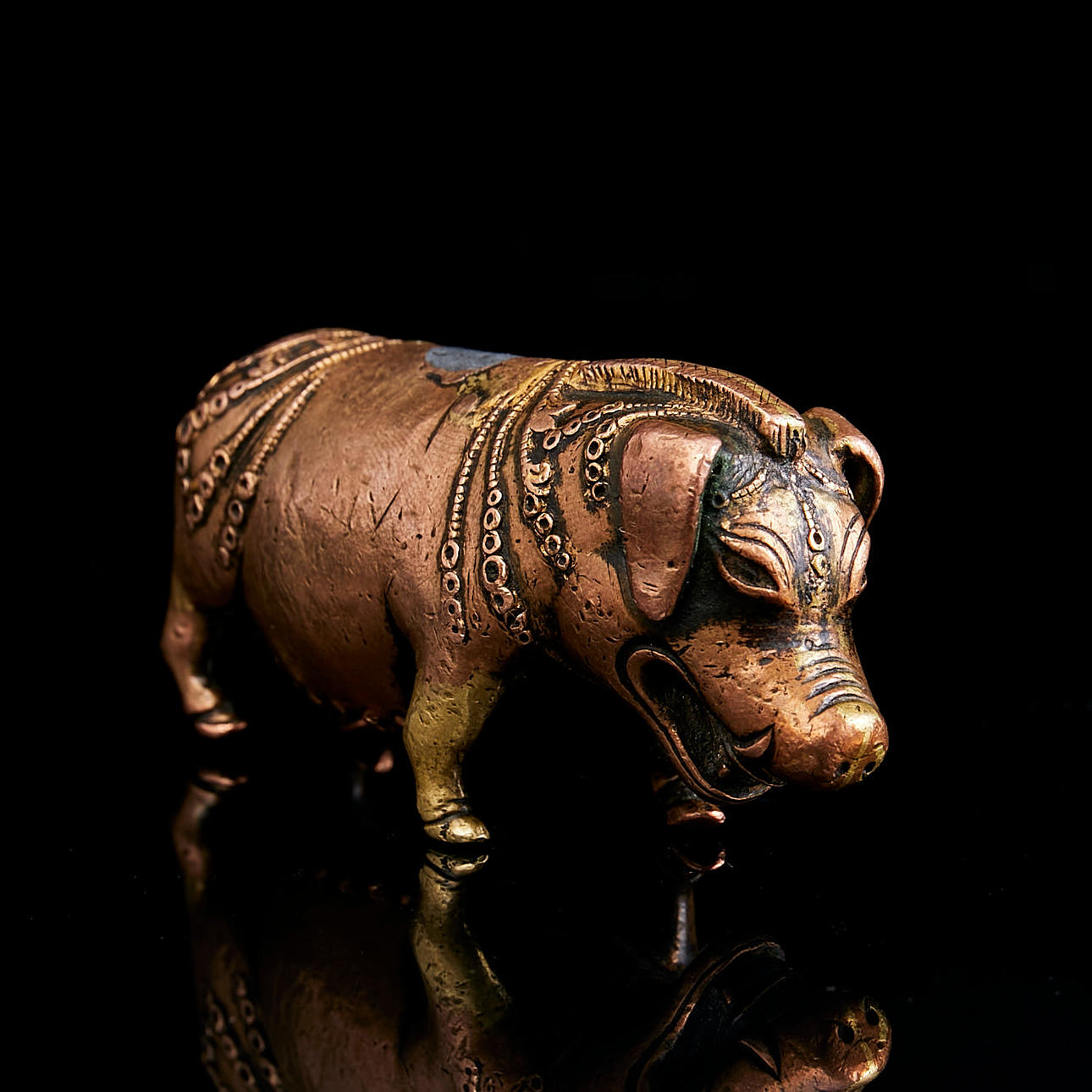 SCULPTURE in the shape of a pig/boar, China, 19th century, possibly a scroll weight, copper alloy with traces of gilding.