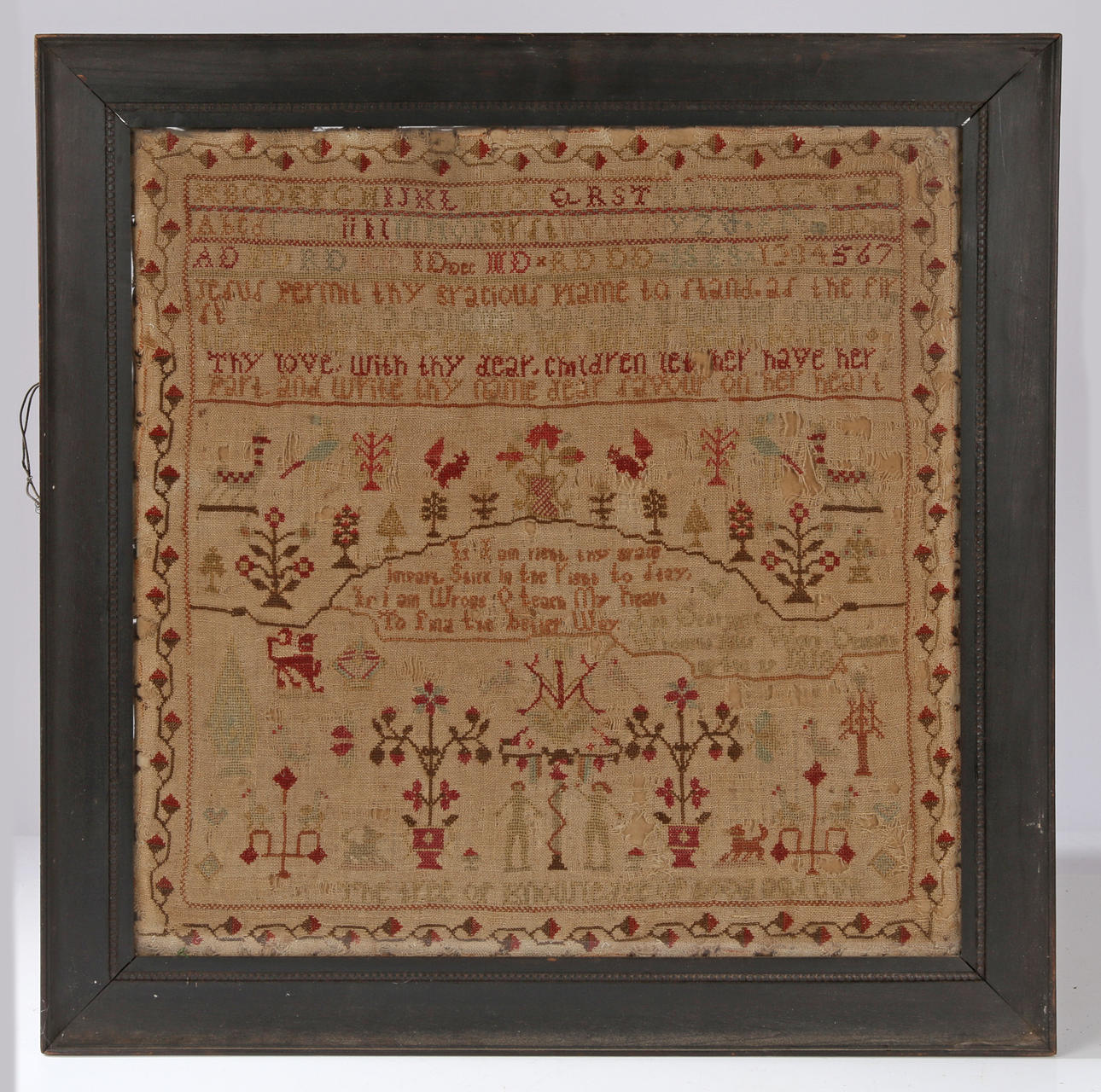 A 18TH/19TH CENTURY WOOL WORK SAMPLER.