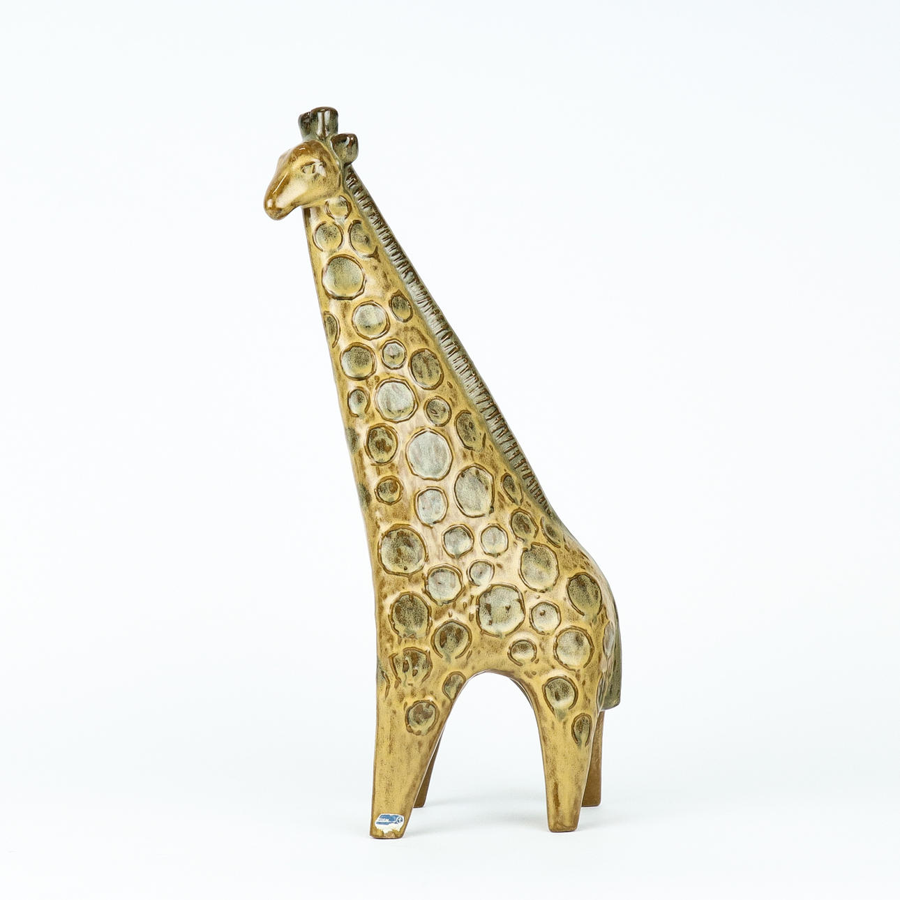 LISA LARSON. The figurine, Giraffe, from the 
