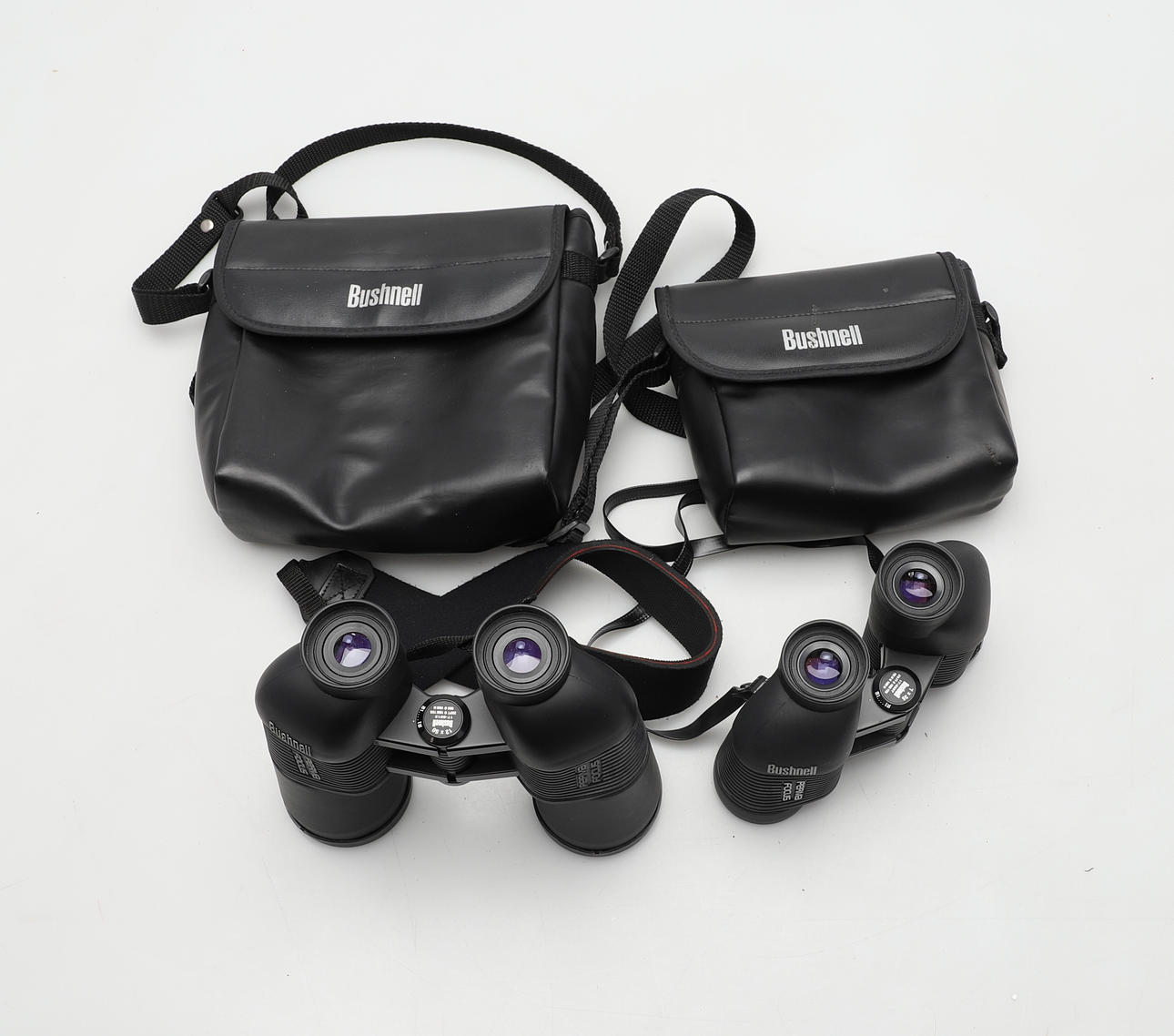 DOS PARES DE GAFAS DE CAMPO BUSHNELL.