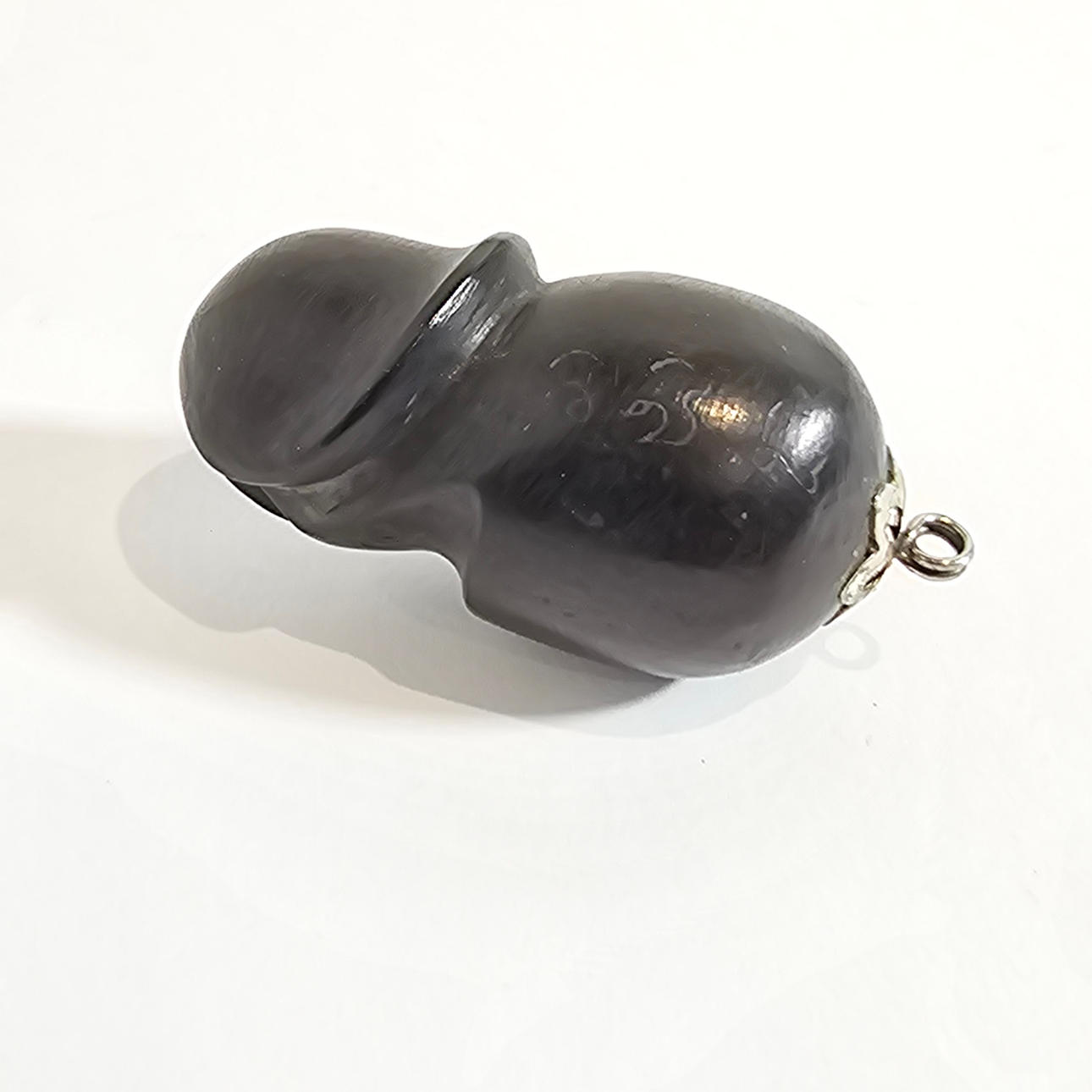 AMULETTFALLOS ATT HÄNGA I EBENHOLTS TRÄ.