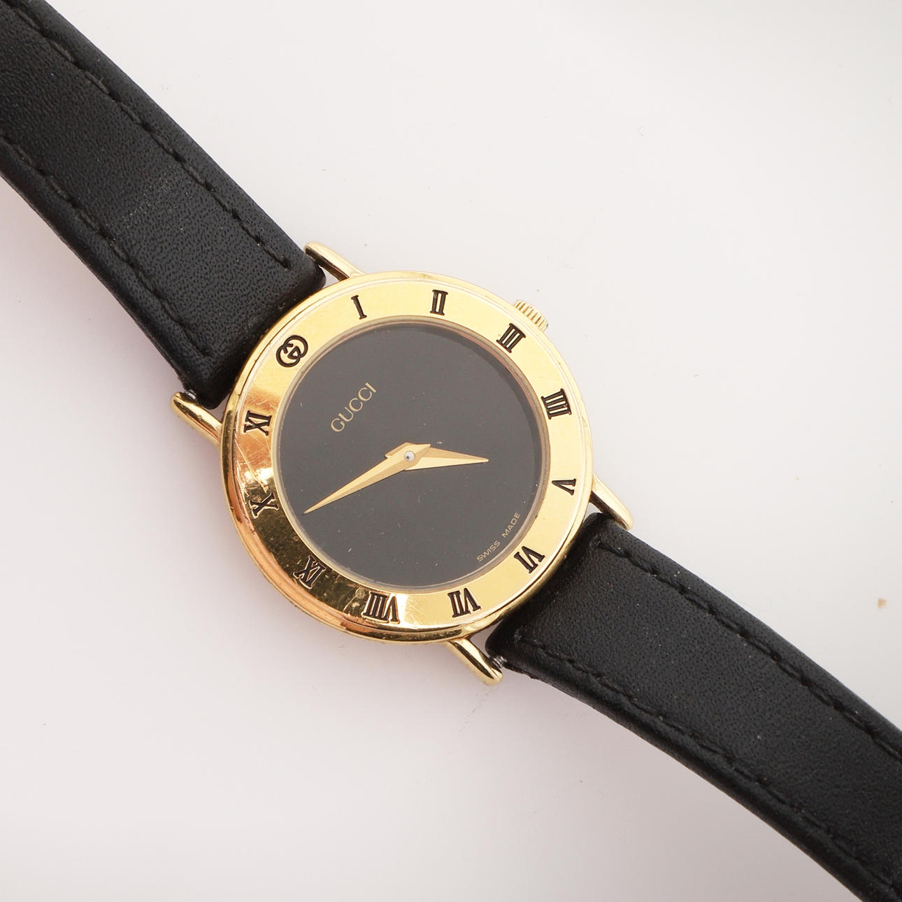 A GOLD PLATED GUCCI WRISTWATCH.