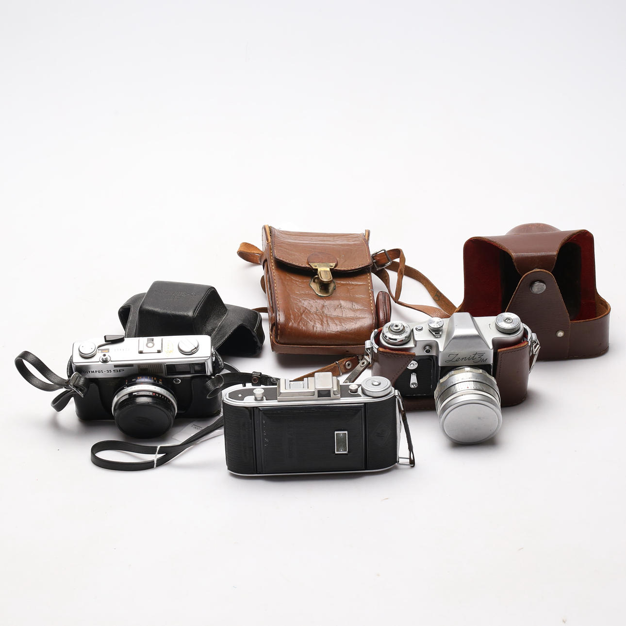 CAMERAS, three parts, zenit, billy record, olympus.