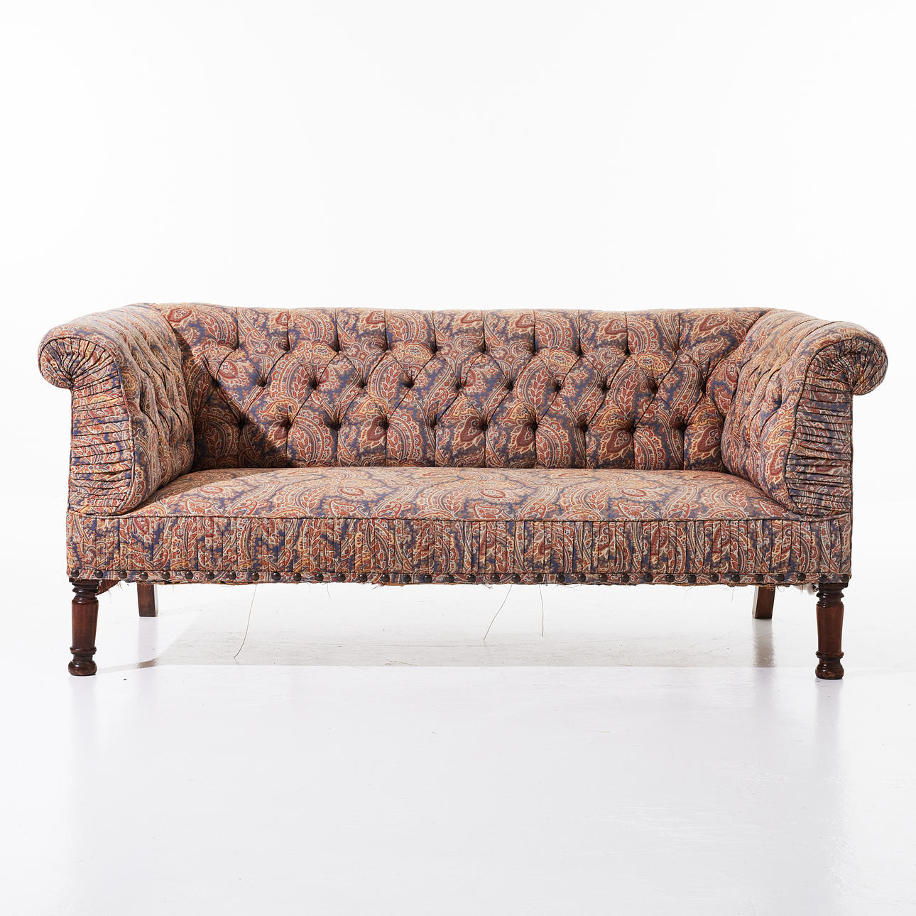SOFA, 1900s, Paisley patterned, turned front legs, deep stitched back.