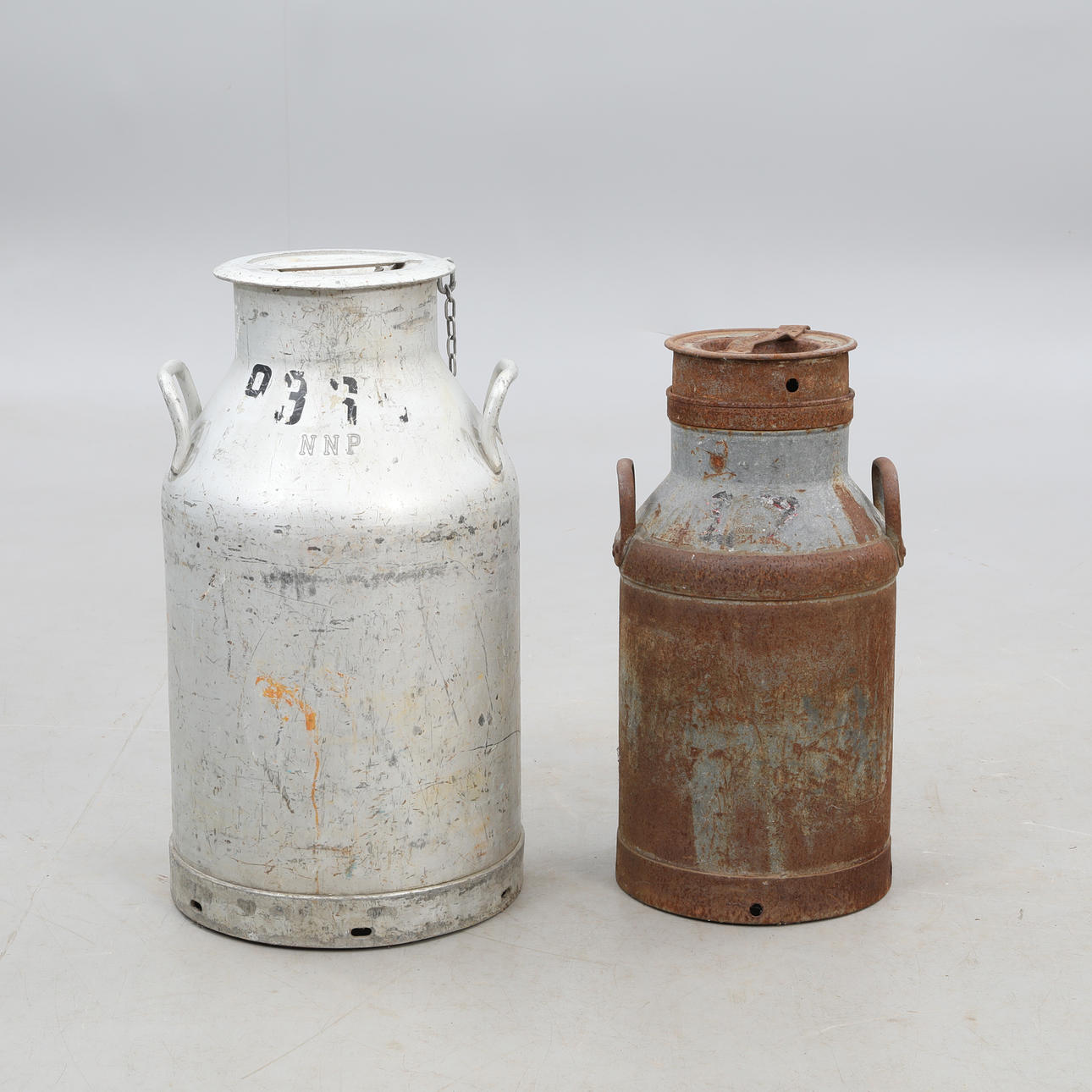 MILK JUGS, a pair, one marked NNP.