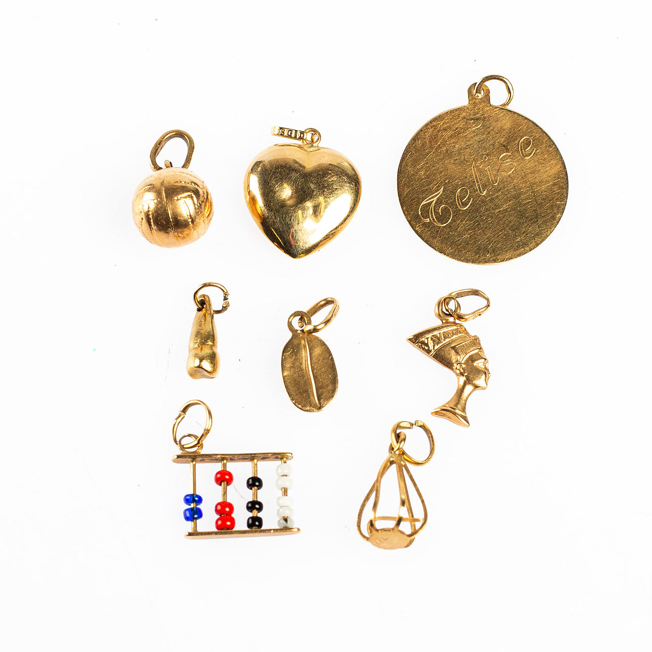 BERLOCKER / HÄNGEN, 8 delar, 18 k guld.