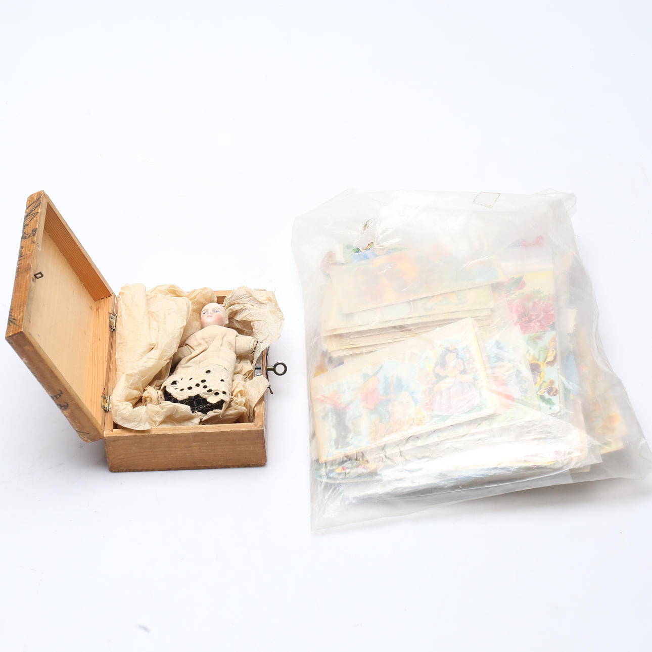BOOKMARKS AND DOLL WITH PORCELAIN HEAD.