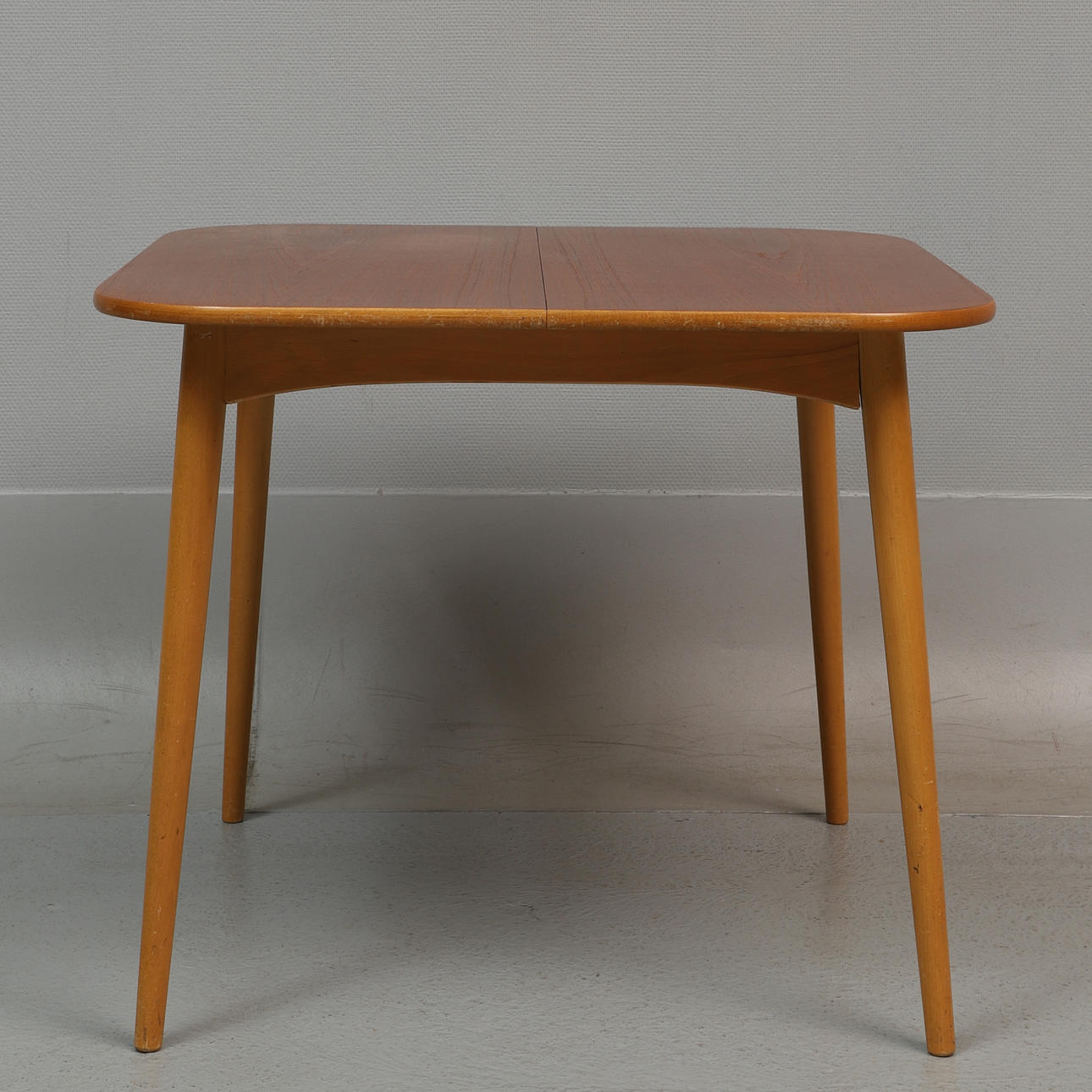 DINING TABLE with insert, teak, 1960s.