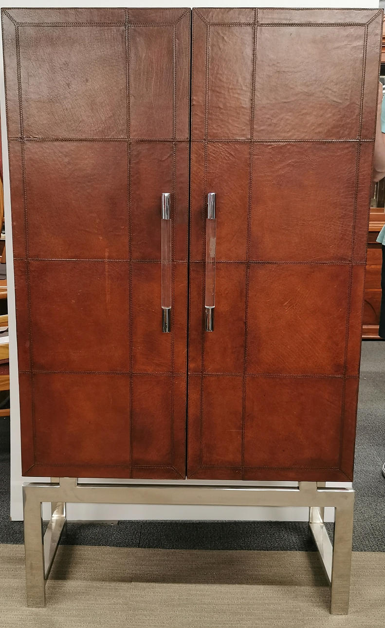 LEATHER AND CHROME BAR CABINET.