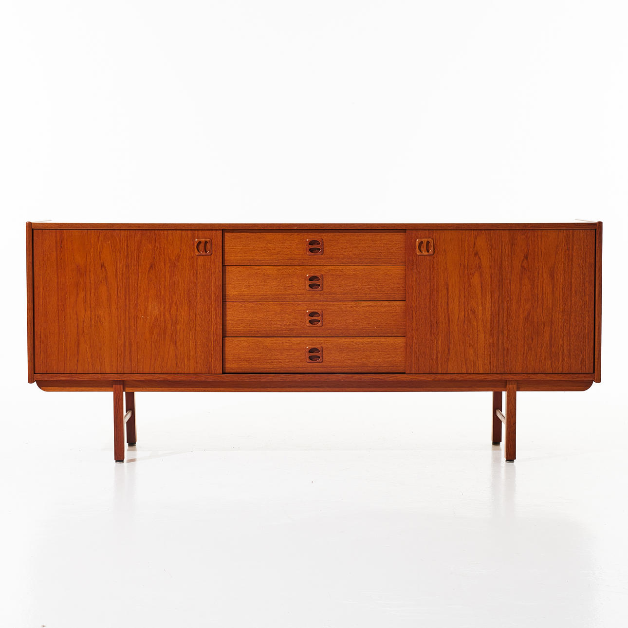 SIDEBOARD, with teak veneer, walnut legs, 1960s.