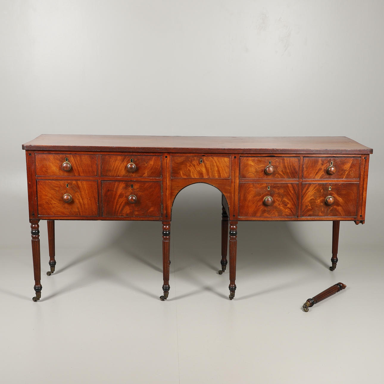 A LARGE MAHOGANY SIDEBOARD.