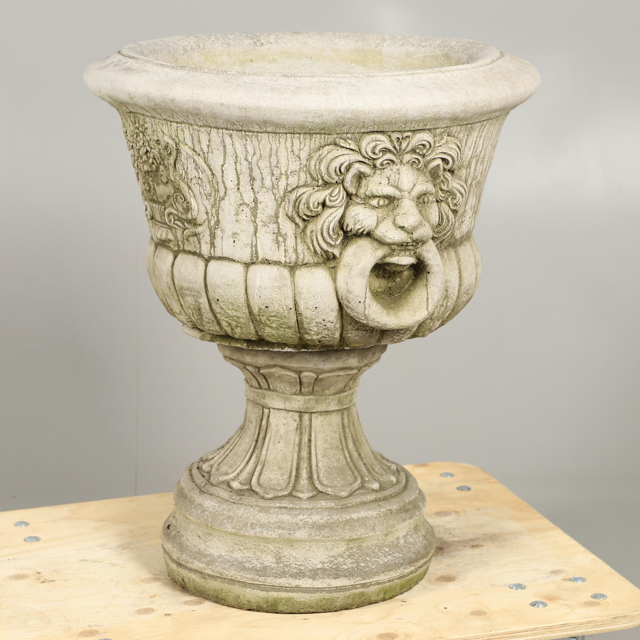A LARGE CONCRETE URN.