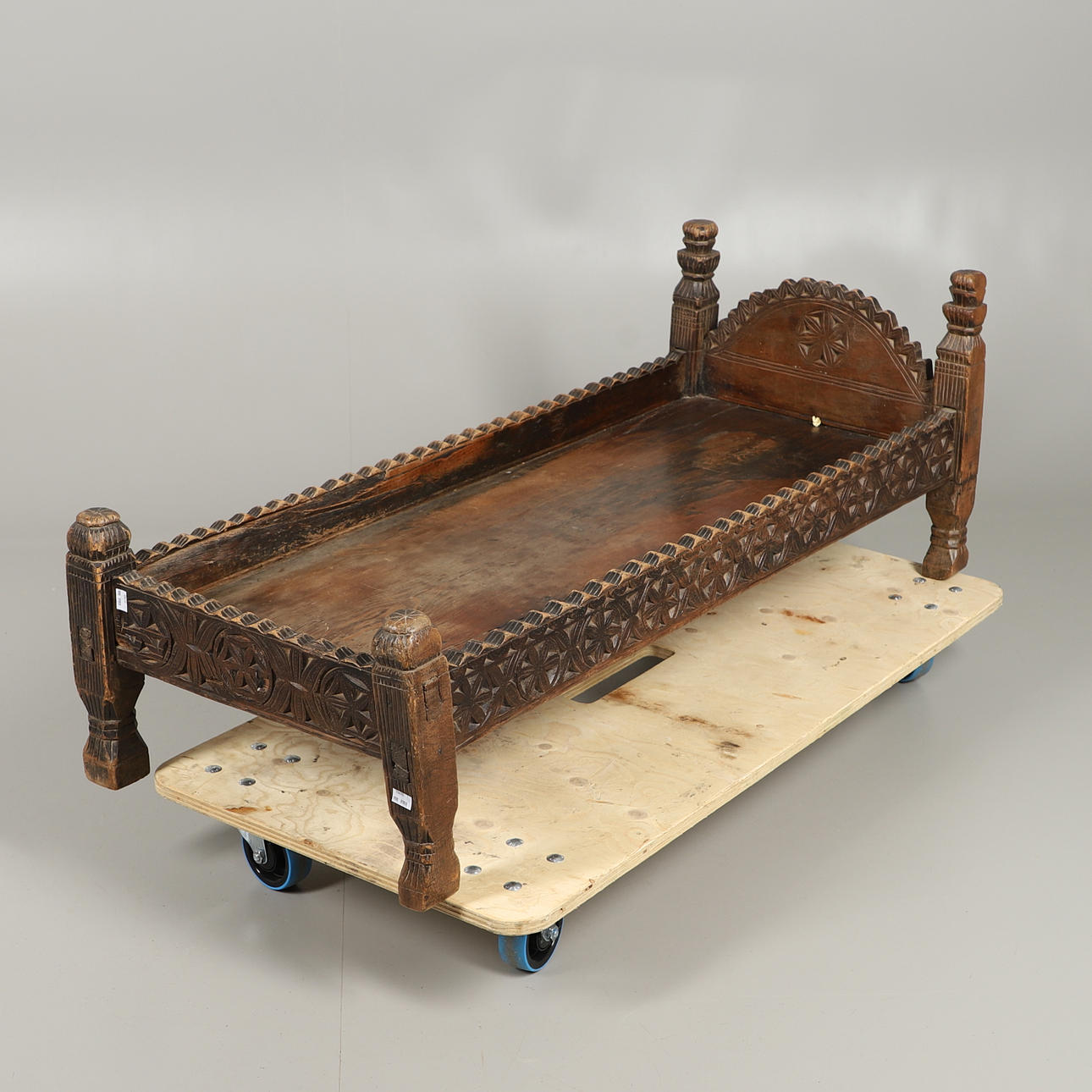 TRIBAL CARVED WOODEN BED.