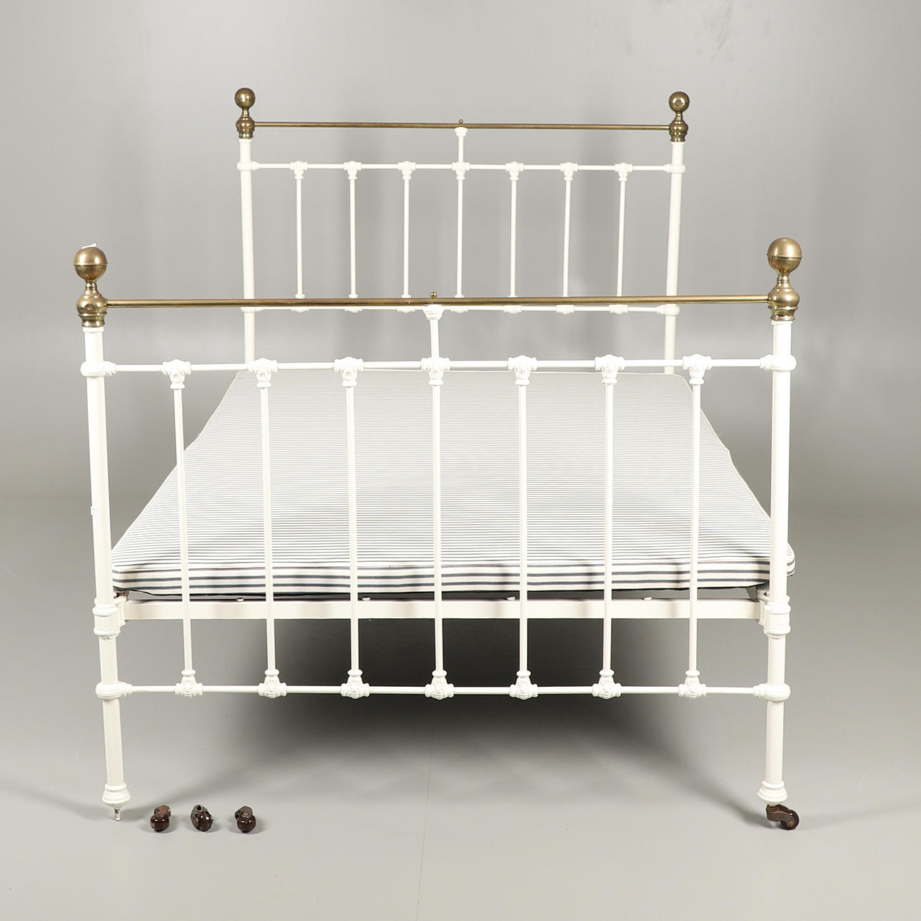 A VICTORIAN PAINTED CAST IRON SMALL DOUBLE BED.