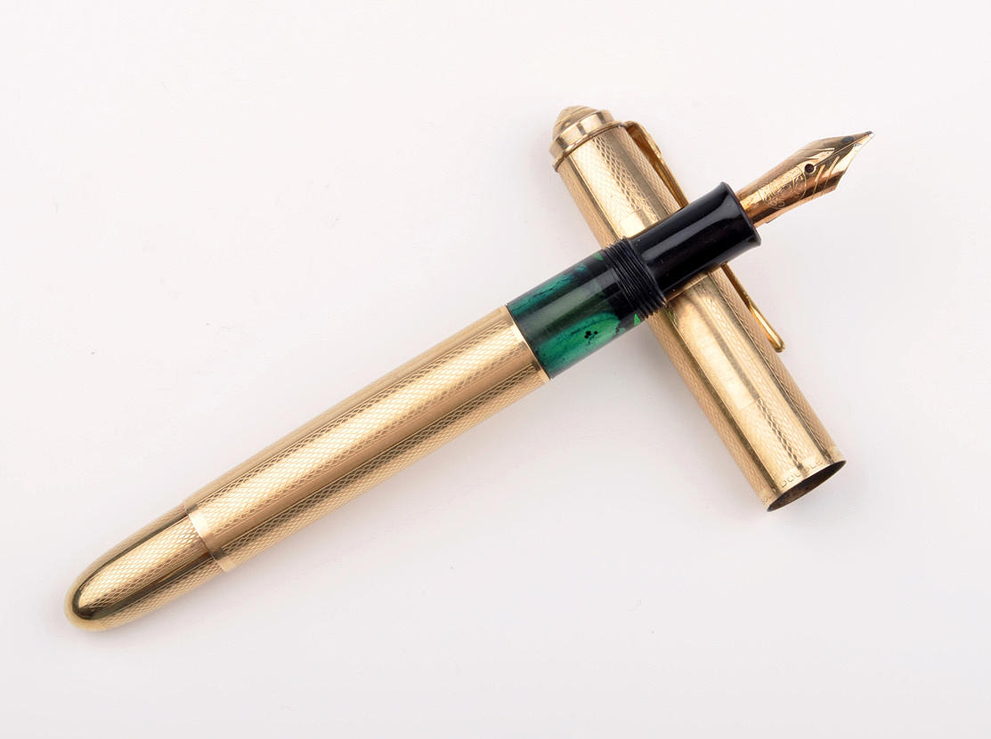 PELIKAN KOLBENFÜLLER. Rolled Gold Double L. kappa helt förgylld, ca 1960.