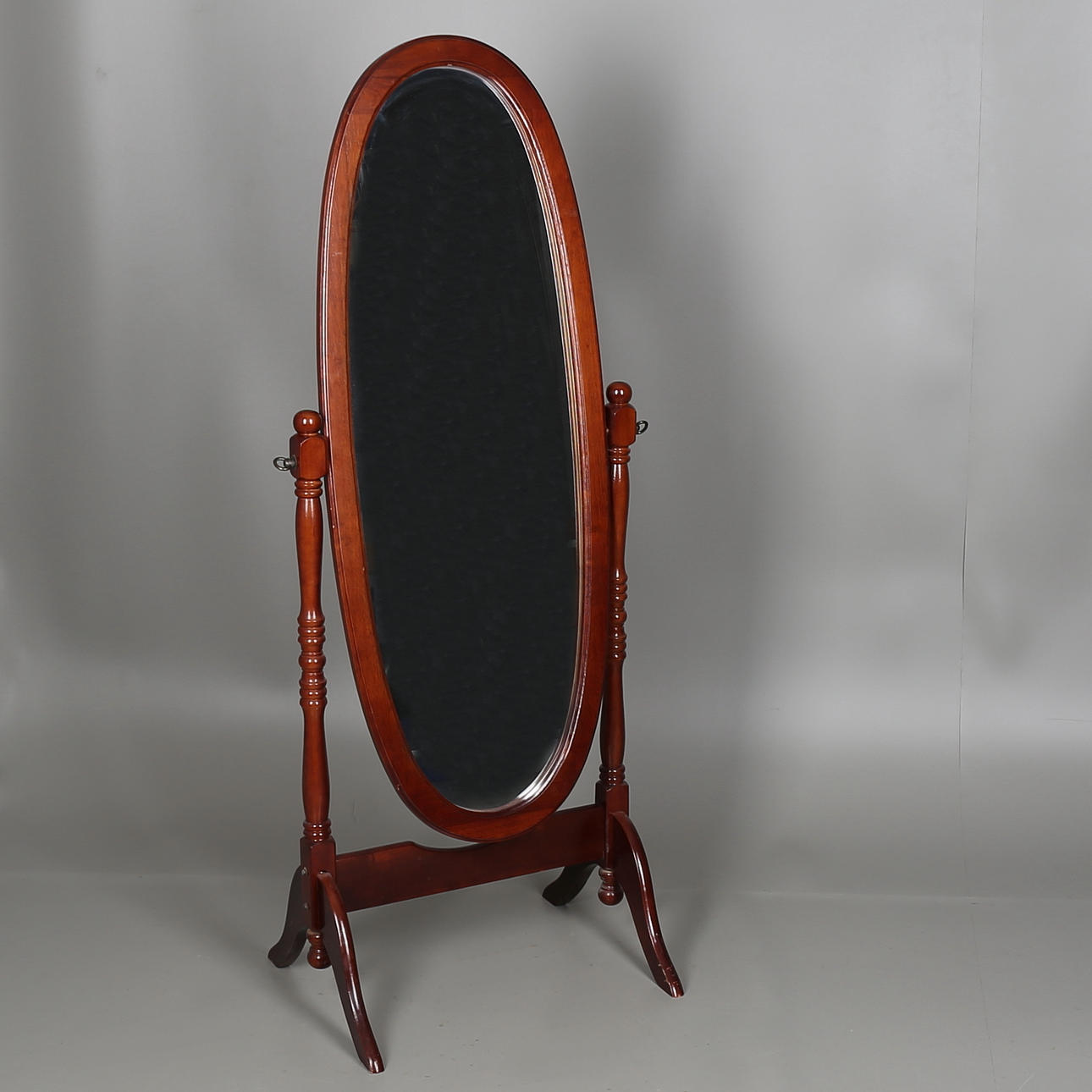 GOLVSPEGEL fanerad i mahogny, 1900-talets andra hälft.