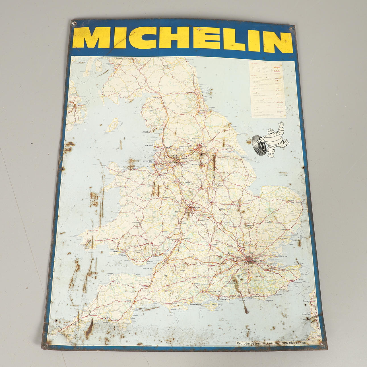 A METAL MICHELIN WALL MAP.