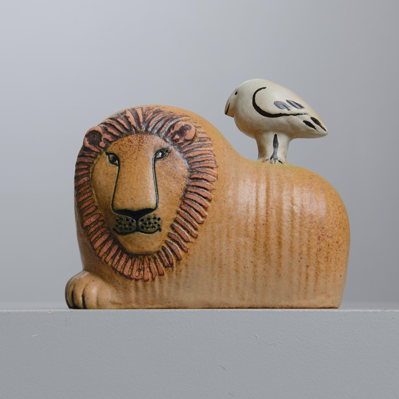LISA LARSON. Lion with bird, K-Studio, Gustavsberg, signed