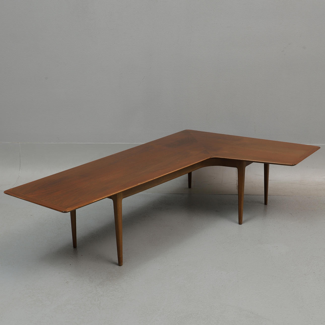 A mid-20th century boomerang table, walnut.