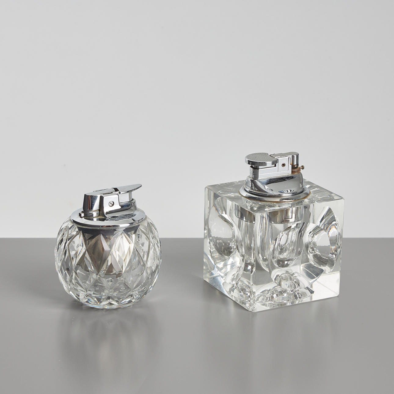TABLE LIGHTERS, 2 pcs, cut glass, white metal.