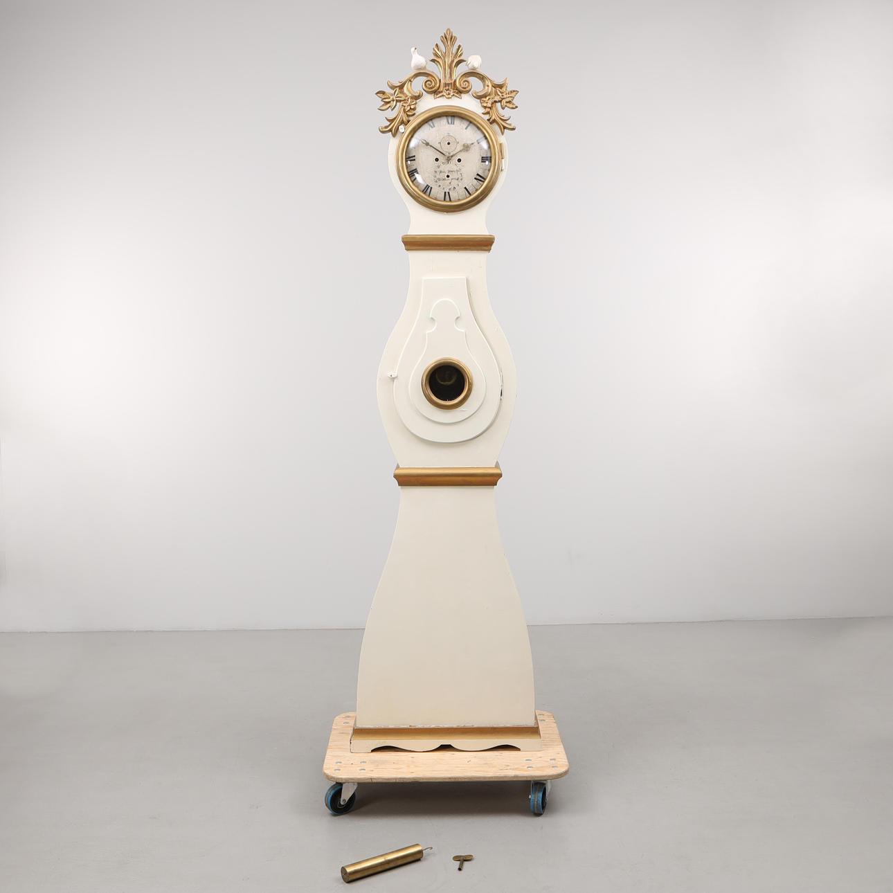 A WOODEN DIAL FLOOR CLOCK, marked Krukö 1830.