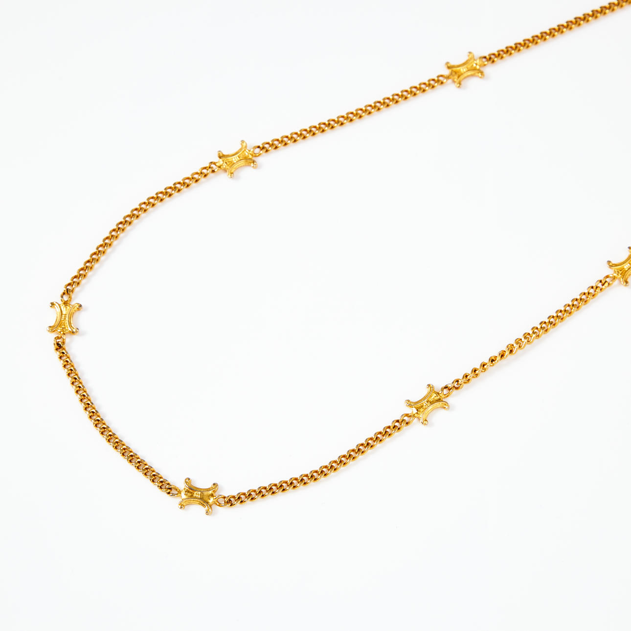 CELINE, necklace, yellow metal, mangled armored link with intermediate decorative elements of the classic TRIOMPHE logo, marked MADE IN ITALY.