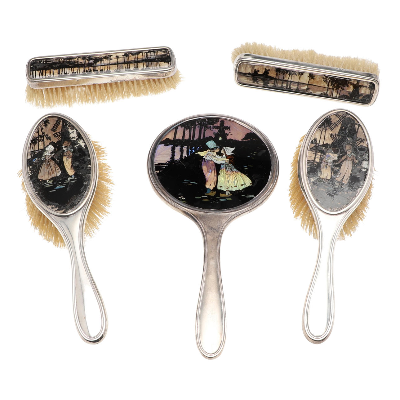 AN EARLY 20TH CENTURY SILVER MOUNTED FIVE-PIECE DRESSING TABLE SET.